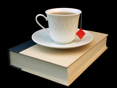 teacup atop book